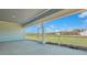 Covered patio with a beautiful view of the sprawling backyard and scenic green space at 207 Bilge Rd, Ridgeville, SC 29472