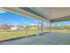 Screened in patio with stunning view of backyard and neighboring homes under construction at 207 Bilge Rd, Ridgeville, SC 29472