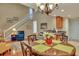 Bright dining room features a round table, chandelier, and hardwood floors at 209 Larissa Dr, Charleston, SC 29414