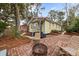 Brick patio with fire pit and seating area in the backyard at 221 Church St, Mount Pleasant, SC 29464