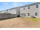 Spacious backyard with patio, grill, and wooden fence at 241 Swamp Creek Ln, Moncks Corner, SC 29461