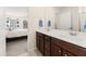 Bathroom with double vanity and a view of a bedroom at 241 Swamp Creek Ln, Moncks Corner, SC 29461