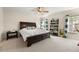 Spacious bedroom with a large bed, shelving unit, and plenty of natural light at 241 Swamp Creek Ln, Moncks Corner, SC 29461