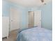 Light blue bedroom with a double bed and plenty of closet space at 241 Swamp Creek Ln, Moncks Corner, SC 29461