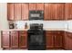Modern kitchen with dark wood cabinets and granite countertops at 241 Swamp Creek Ln, Moncks Corner, SC 29461