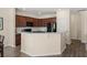 Kitchen with dark wood cabinets, granite countertops, and black appliances at 241 Swamp Creek Ln, Moncks Corner, SC 29461