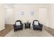 Sitting area with two black leather chairs and a round table at 241 Swamp Creek Ln, Moncks Corner, SC 29461
