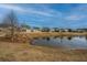 Community pond view with homes and landscaping at 310 Bloomington Way, Summerville, SC 29486