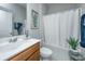Clean bathroom with a single vanity, tub shower combo, and neutral decor at 310 Bloomington Way, Summerville, SC 29486