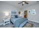 Bedroom with a cozy bed, a side table, and a view of the bathroom at 310 Bloomington Way, Summerville, SC 29486