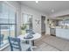 Bright dining area with white table and blue chairs, near kitchen at 310 Bloomington Way, Summerville, SC 29486