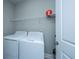 Laundry room with washer and dryer, and overhead shelving at 310 Bloomington Way, Summerville, SC 29486