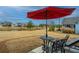 Private patio with table, chairs, and red umbrella at 310 Bloomington Way, Summerville, SC 29486