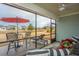 Enjoy this screened porch with outdoor furniture and red umbrella at 310 Bloomington Way, Summerville, SC 29486