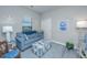 Cozy sitting room with a blue sofa and ottoman, creating a relaxing space at 310 Bloomington Way, Summerville, SC 29486