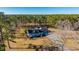 An aerial view of the house nestled in a wooded area at 490 Cummings Chapel Rd, Ridgeville, SC 29472