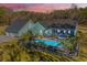 Aerial view of a home with pool at dusk at 490 Cummings Chapel Rd, Ridgeville, SC 29472