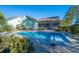 Home exterior showcasing a spacious backyard with a pool and lush landscaping at 490 Cummings Chapel Rd, Ridgeville, SC 29472