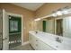 Bathroom with double vanity and view of green bedroom at 490 Cummings Chapel Rd, Ridgeville, SC 29472