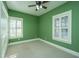 Bedroom with green walls, ceiling fan, and carpet at 490 Cummings Chapel Rd, Ridgeville, SC 29472
