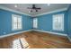 Bright bedroom with hardwood floors and plantation shutters at 490 Cummings Chapel Rd, Ridgeville, SC 29472