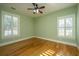 Bright bedroom with hardwood floors and plantation shutters at 490 Cummings Chapel Rd, Ridgeville, SC 29472