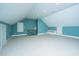 Large bonus room offering versatile space with a built in bench and staircase at 490 Cummings Chapel Rd, Ridgeville, SC 29472
