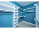 Spacious walk-in closet with built-in shelves and rods at 490 Cummings Chapel Rd, Ridgeville, SC 29472