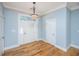 Bright entryway with hardwood floors and a stained glass light fixture at 490 Cummings Chapel Rd, Ridgeville, SC 29472