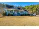 Charming craftsman home with front porch and landscaped yard at 490 Cummings Chapel Rd, Ridgeville, SC 29472