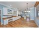 Spacious kitchen featuring white cabinets, granite countertops, and hardwood floors at 490 Cummings Chapel Rd, Ridgeville, SC 29472