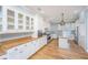 Bright kitchen with white cabinets, wood countertops, stainless steel appliances, and hardwood floors at 490 Cummings Chapel Rd, Ridgeville, SC 29472