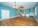 Bright living room with hardwood floors, ceiling fan and plantation shutters at 490 Cummings Chapel Rd, Ridgeville, SC 29472