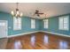 Spacious living room with hardwood floors, ceiling fan, and plantation shutters at 490 Cummings Chapel Rd, Ridgeville, SC 29472