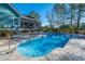 Inviting kidney-shaped pool with concrete decking at 490 Cummings Chapel Rd, Ridgeville, SC 29472