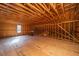 Unfinished attic space with window at 490 Cummings Chapel Rd, Ridgeville, SC 29472