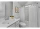 Clean bathroom with white vanity, bathtub, and white curtains at 507 N Commodore Way, Summerville, SC 29483