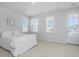 Spacious bedroom with white bedding and private balcony at 507 N Commodore Way, Summerville, SC 29483