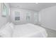 Bright bedroom with white bedding and private balcony access at 507 N Commodore Way, Summerville, SC 29483