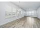 Spacious dining area with hardwood floors and natural light from large windows at 507 N Commodore Way, Summerville, SC 29483