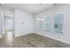 Bright dining room with hardwood floors and chandelier at 507 N Commodore Way, Summerville, SC 29483