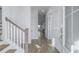 Bright and spacious entryway with staircase and view into the living area at 507 N Commodore Way, Summerville, SC 29483