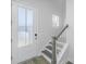 Staircase and front door with patterned glass in entryway at 507 N Commodore Way, Summerville, SC 29483