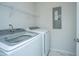 Laundry room with washer, dryer, and shelving at 507 N Commodore Way, Summerville, SC 29483