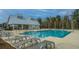 Resort-style pool with adjacent clubhouse and lounge chairs at 507 N Commodore Way, Summerville, SC 29483