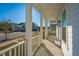 Front porch with white columns and neighborhood view at 507 N Commodore Way, Summerville, SC 29483