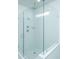 Spacious walk-in shower with white tile and glass doors at 507 N Commodore Way, Summerville, SC 29483