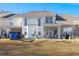 Townhouse backyard with patio, grassy area, and storage shed at 5222 Chicory Ln, North Charleston, SC 29420