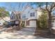 Townhouse with brick and white vinyl siding, attached garage, and landscaping at 5222 Chicory Ln, North Charleston, SC 29420