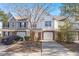 Three-unit townhouse building, brick and siding exterior, attached garages, landscaping at 5222 Chicory Ln, North Charleston, SC 29420